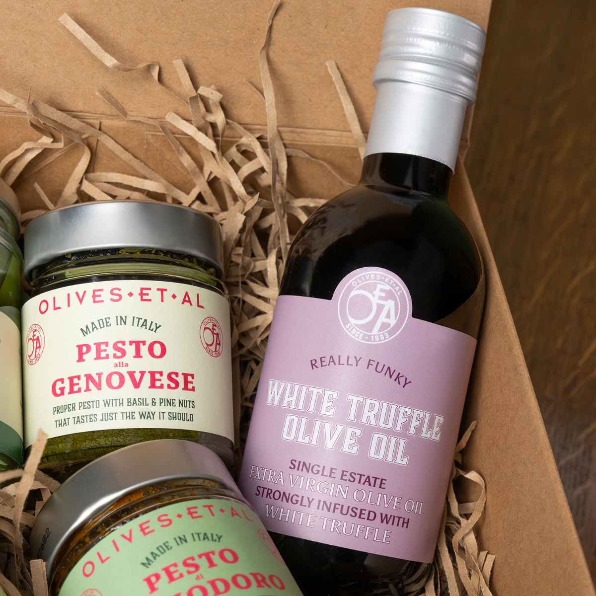 Olives Et Al - A Taste Of Italy Gift Set - Bottle of white truffle olive oil and jars of pesto in a gift box with brown paper