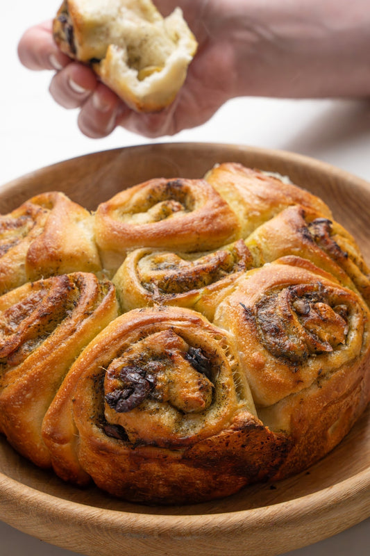 Pull‑apart pesto and olive bread close‑up