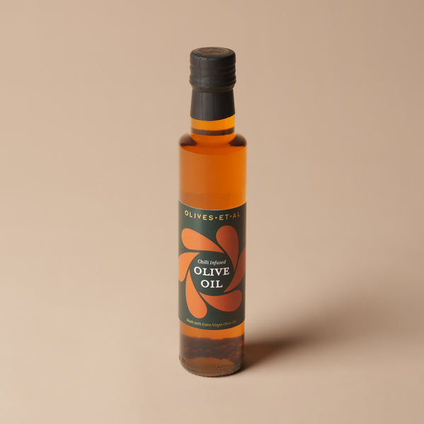 Olives Et Al Aleppo Chilli Olive Oil in a 250ml glass bottle, filled with extra virgin olive oil infused with fruity Aleppo chilli flakes, paprika and a touch of bird’s eye chilli heat. Its gently smoky flavour makes a delicious addition to Christmas cooking, from roasted vegetables and festive starters to warm bread and homemade dips. A thoughtful Christmas stocking filler or gourmet gift for food lovers, this aromatic chilli oil brings a little Mediterranean warmth to seasonal meals and festive gatherings