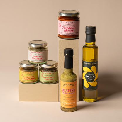 Olives Et Al BBQ Marinades Bundle featuring a flavour-packed selection of bottles, jars and seasonings for marinating and grilling. The bundle includes fragrant Lemon Olive Oil, adding bright citrus flavour to meat, fish and vegetables, alongside savoury spice blends inspired by Mediterranean and Middle Eastern cooking. Souvlaki Greek grilling spices combine aromatic herbs and seasonings, while Shawarma Levantine spices deliver warm, fragrant depth and Adana Turkish kebab seasoning brings bold, savoury char
