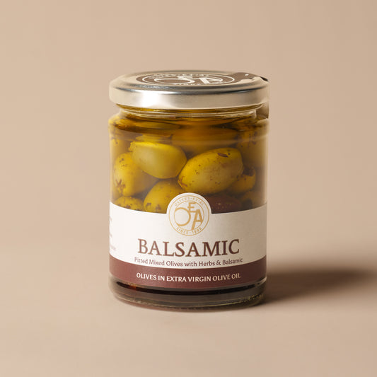 Olives Et Al Balsamic Pitted Mixed Olives in a 250g glass jar, combining green and Kalamata olives in extra virgin olive oil with traditionally matured Balsamic Vinegar of Modena, garlic, oregano, rosemary and thyme. Rich, savoury and gently sweet, these Mediterranean olives make a thoughtful Christmas stocking filler or addition to a festive food hamper. Perfect for Christmas cheeseboards, party nibbles and sharing with crusty bread, their aromatic balsamic marinade is delicious for dipping and drizzling.