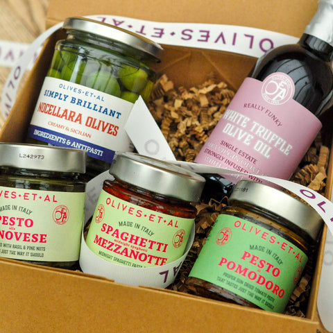 Assorted Olives Et Al products including jars and a bottle in a box labeled 'Olives Et Al'.