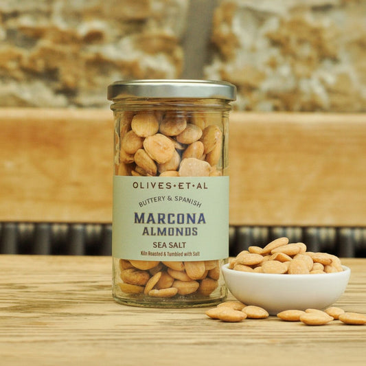 Olives Et Al Marcona Almonds on a wooden table