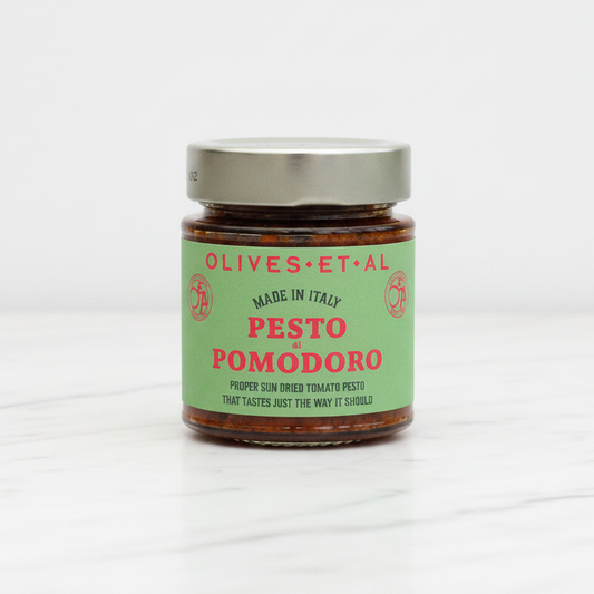 Jar of Olives et al Pesto Pomodoro on a white background