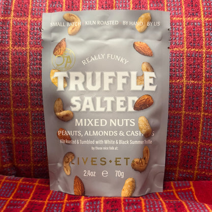 Truffle Salter mixed nuts packaging on a red and orange checkered background