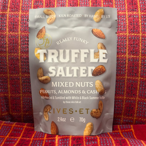 Truffle Salter mixed nuts packaging on a red and orange checkered background