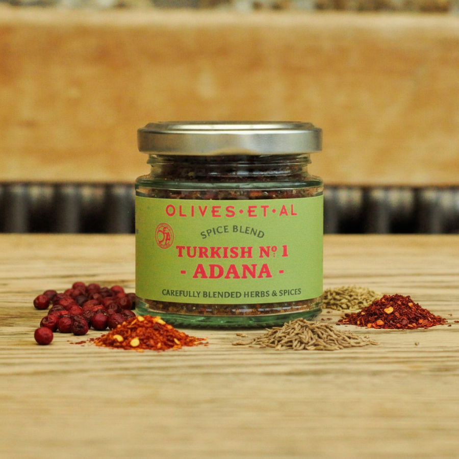 adana kebab spices and jar on wooden background