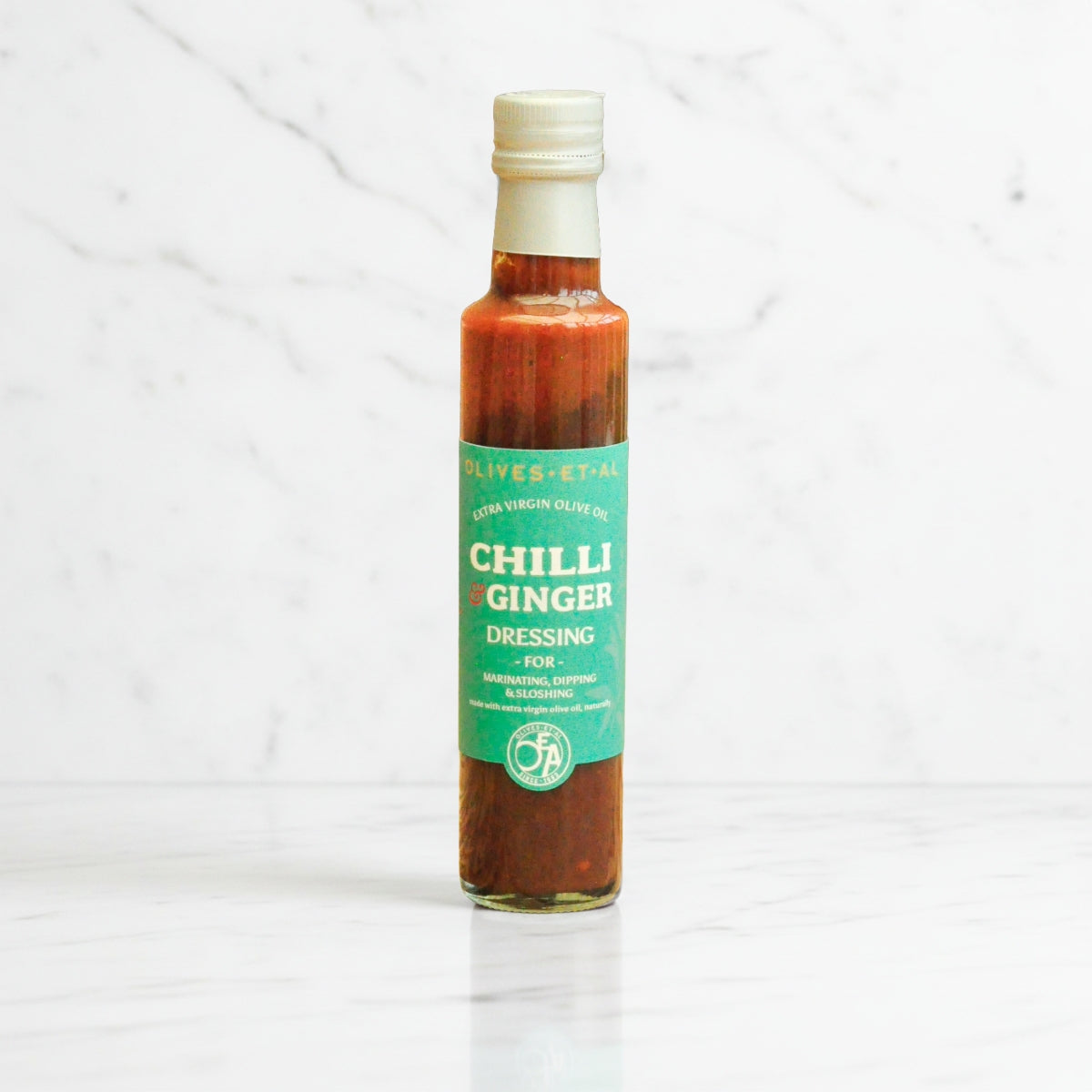 Bottle of Chilli Ginger dressing on a white background