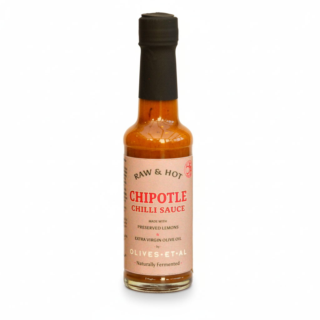 Bottle of chipotle chili sauce with a black cap on a white background