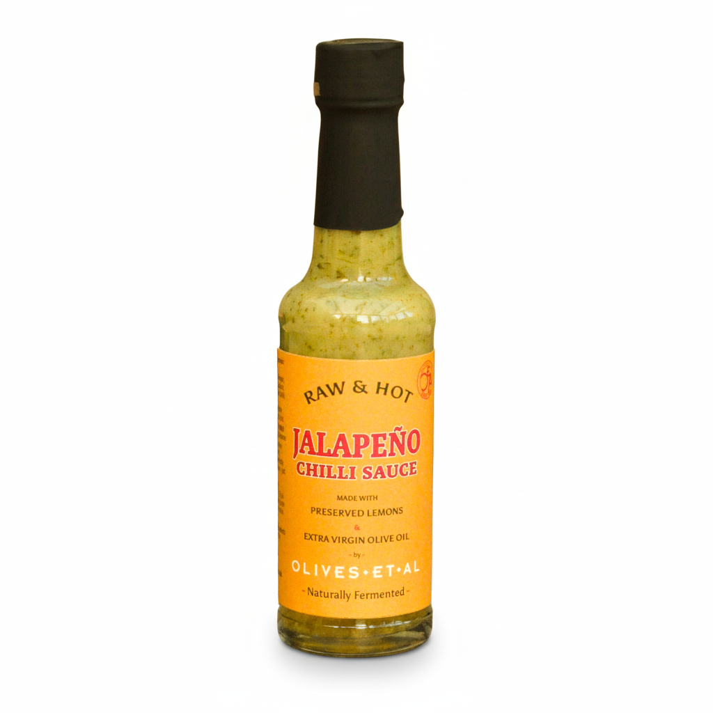 Bottle of Jalapeño chili sauce with a yellow label on a white background