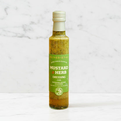 Bottle of mustard & herb dressing with extra virgin olive oil, classic French-style dressing made in the UK for salads and marinades