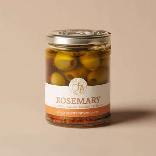 Olives Et Al Rosemary Pitted Mixed Olives in a 250g glass jar, filled with green and Kalamata olives marinated in extra virgin olive oil with fragrant rosemary, red pepper and garlic. The savoury blend offers woody herbal notes, gentle warmth and a touch of sweetness. A lovely Christmas stocking filler or gourmet hamper addition for olive lovers, perfect for festive cheeseboards, party nibbles and Christmas Eve grazing. Serve with warm focaccia, baked feta or roast meats, and use the infused oil for dipping