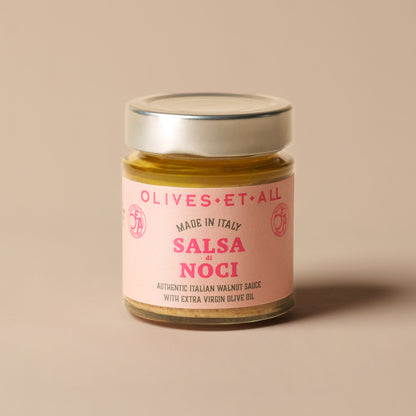 Olives Et Al Salsa di Noci Italian Walnut Sauce in a 135g glass jar, filled with a smooth, creamy blend of walnuts, cashews, extra virgin olive oil, Parmesan cheese, garlic and marjoram. Its rich, nutty flavour makes a thoughtful Christmas stocking filler or gourmet food hamper addition. Perfect for festive entertaining, stir into pasta or gnocchi, spoon over roasted winter vegetables, or spread onto warm bread for Christmas party nibbles. A delicious Italian treat for food lovers to enjoy over the holidays