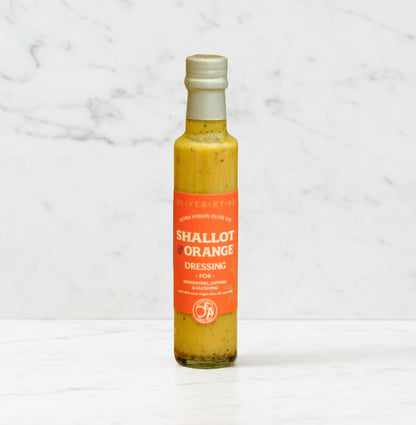 Bottle of shallot and orange dressing with extra virgin olive oil, no seed oils, citrus and shallot gourmet dressing made in the UK