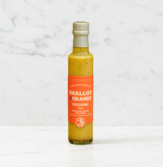 Bottle of shallot and orange dressing with extra virgin olive oil, no seed oils, citrus and shallot gourmet dressing made in the UK